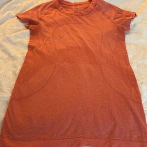 Orange Lululemon tshirt, size 6